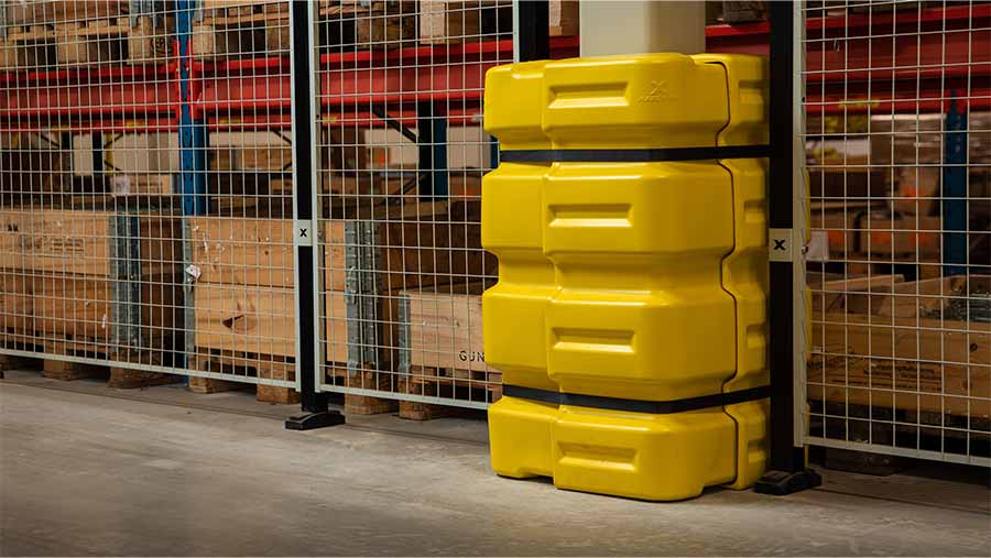 yellow and black column guard protecting pillar in industrial environment